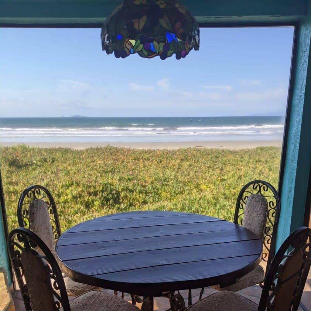 writing table with four chairs, with a view of the beach in Mexico
